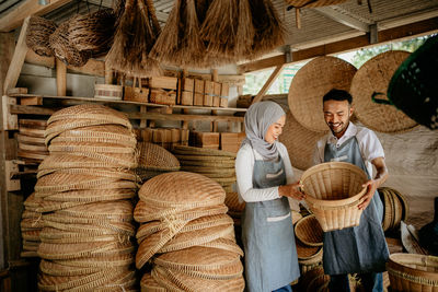 Rear view of man working at market