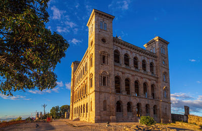 Low angle view of historical building against blue sky