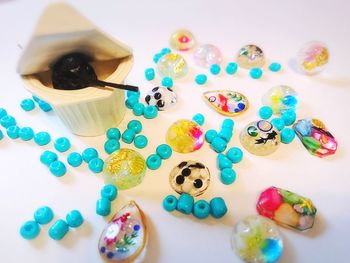 High angle view of multi colored candies on table