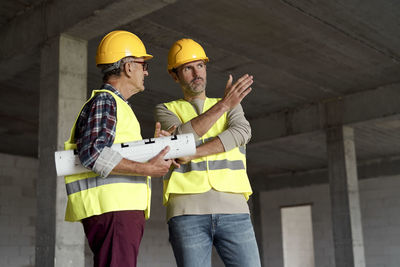 Low angle view of engineers having discussion