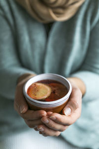 Close-up of woman hand holding drink