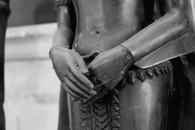 Close-up of man working on metal