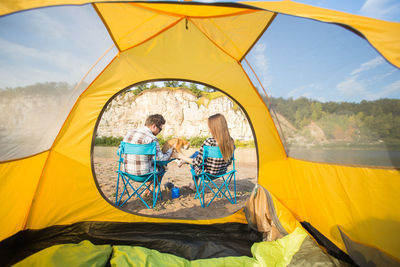 People sitting in tent