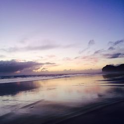 Scenic view of sea against sky at sunset