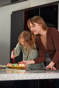 Side view of young woman working at home