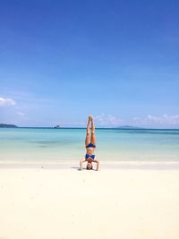 Man on beach against sky