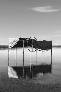 Lifeguard hut on beach against sky