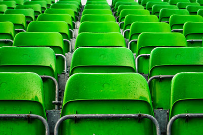 Full frame shot of green empty chairs