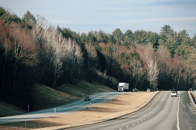 High angle view of cars on road against sky