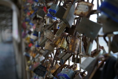 Close-up of padlocks hanging on metal