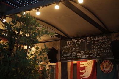 Information sign in illuminated restaurant