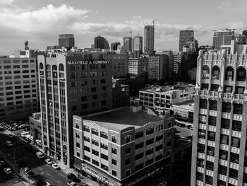 High angle view of buildings in city against sky