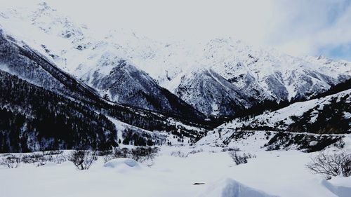 Snow covered mountains against sky