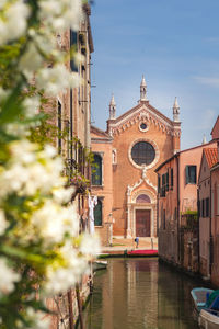 Canal in venice and church of madonna dell'orto in the distance. venice, italy