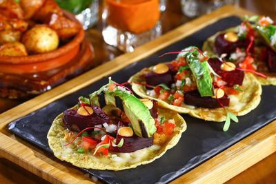 Close-up of food on serving tray over table