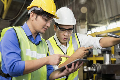 Young man working in mirror