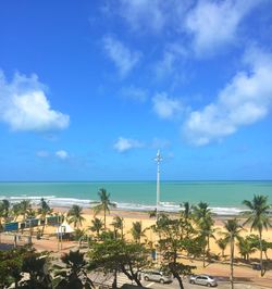 Scenic view of beach against blue sky