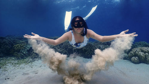 Young woman freediving 