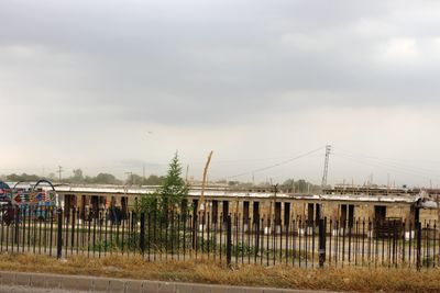 View of bridge against cloudy sky