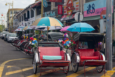 Vehicles on road along buildings