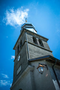 Low angle view of clock tower against sky