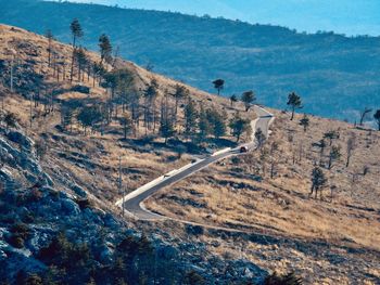 High angle view of road amidst mountains