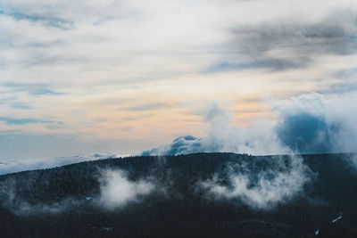 Scenic view of clouds over mountain against sky