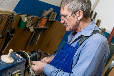 Carpenter working in workshop