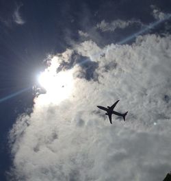 Low angle view of airplane flying in sky