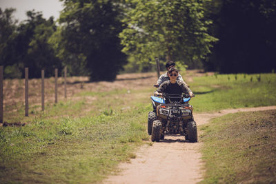 Man riding motorcycle on field