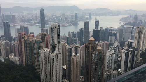 High angle view of buildings in city against sky