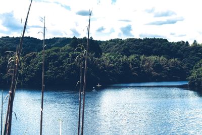 Scenic view of lake against cloudy sky
