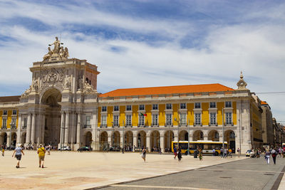 Group of people in front of historical building