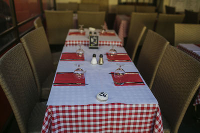 High angle view of chairs and tables in restaurant