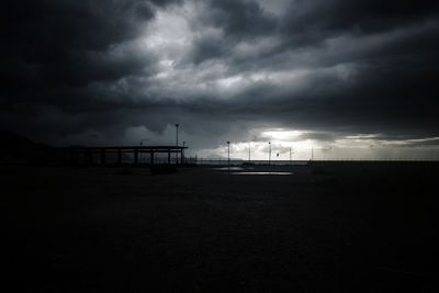 Scenic view of sea against storm clouds