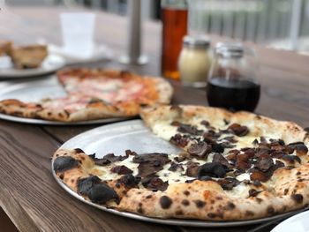 Close-up of pizza served on table