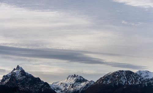 Scenic view of snowcapped mountains against sky