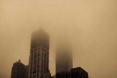 Low angle view of buildings against sky in city