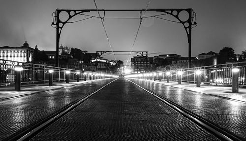 View of illuminated bridge in city at night