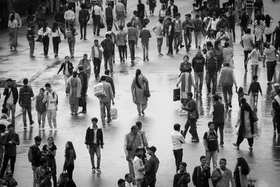 High angle view of people walking on street in city