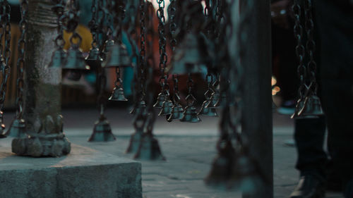 Close-up of chain hanging on wall by old building