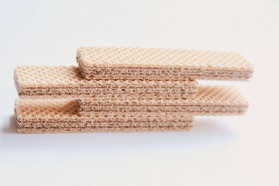 Close-up of stack wafer against white background