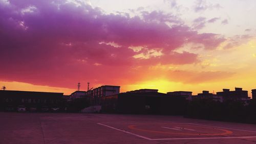 City against sky at sunset