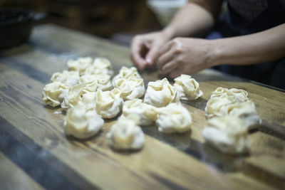 Midsection of man preparing food