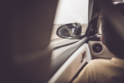 Close-up of boy traveling in car