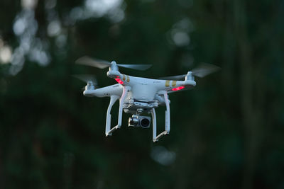 Close-up of airplane flying against blurred background