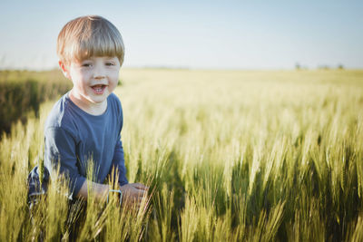 Portrait of boy on field