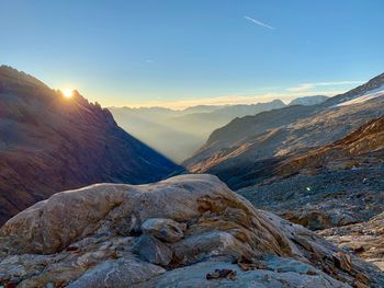 Scenic view of mountains against sky during sunset