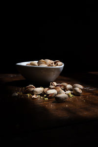 Close-up of breakfast on table against black background