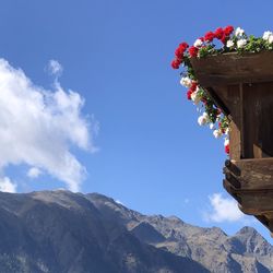 Low angle view of mountain against blue sky